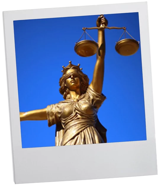 Photo of a gold statue of the scales of justice