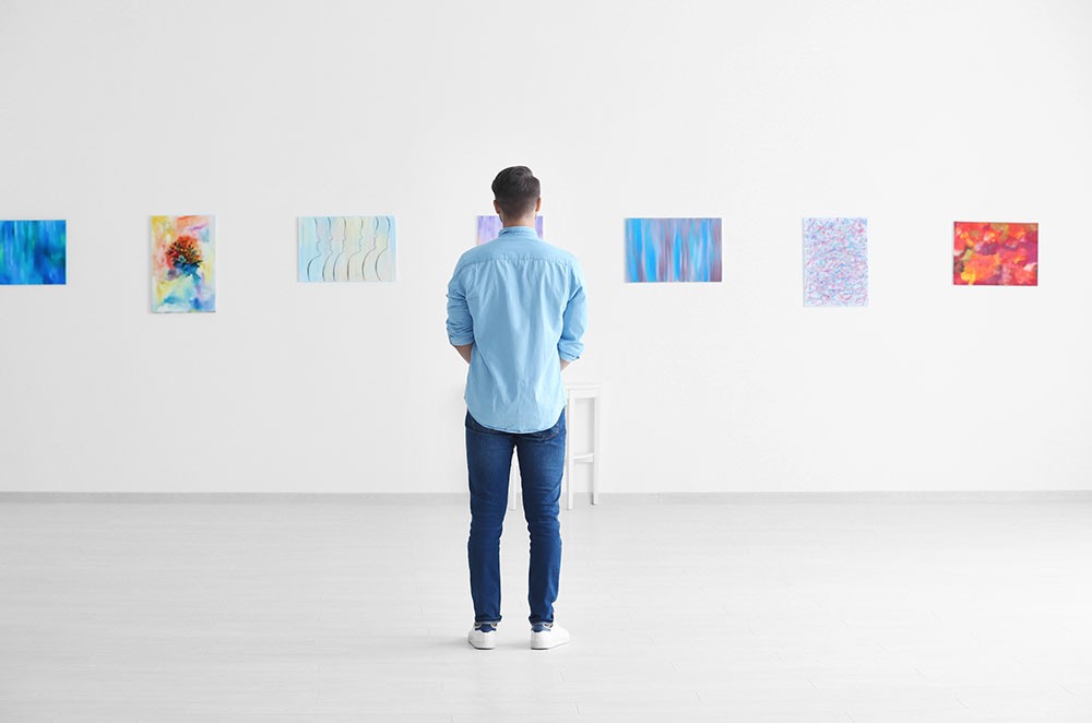 Young man in art gallery