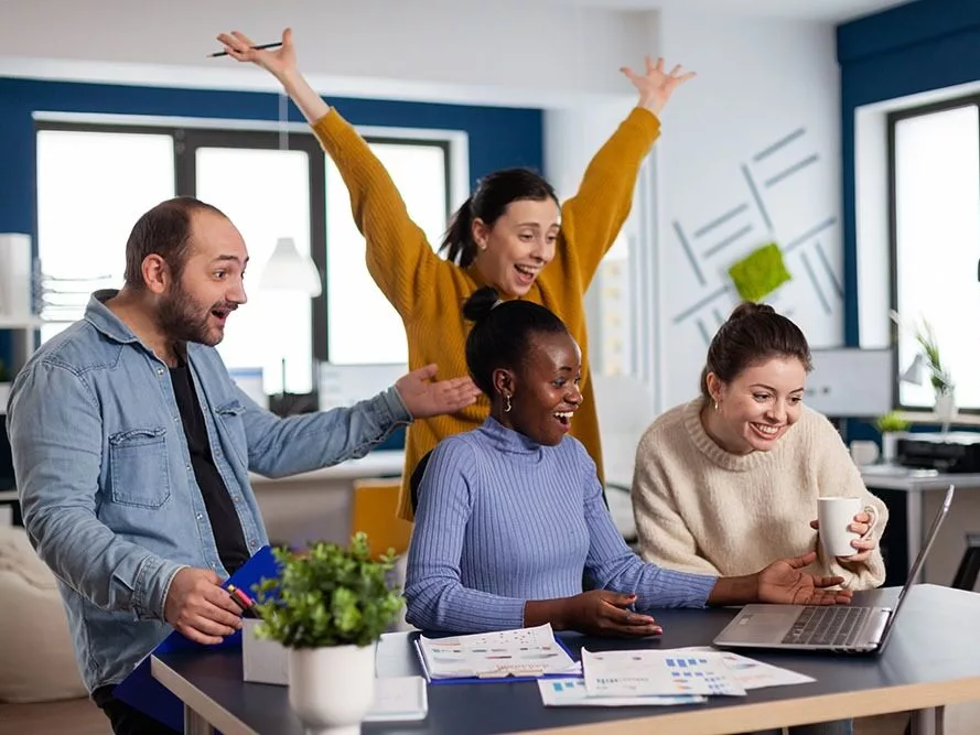 Young diverse group of entrepreneurs with hands up looking surprised